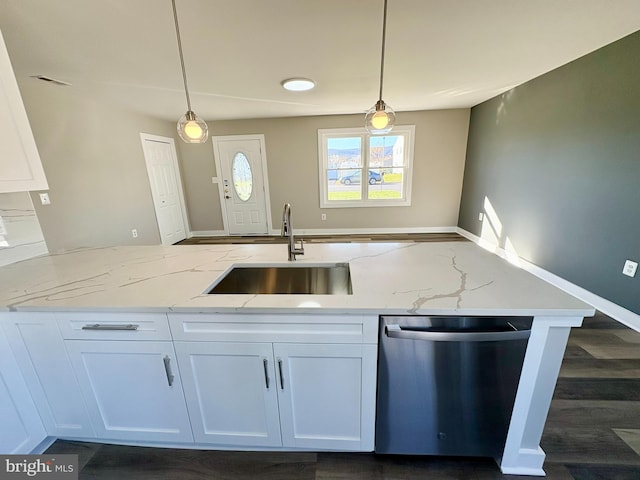 kitchen featuring white cabinets, stainless steel dishwasher, and sink