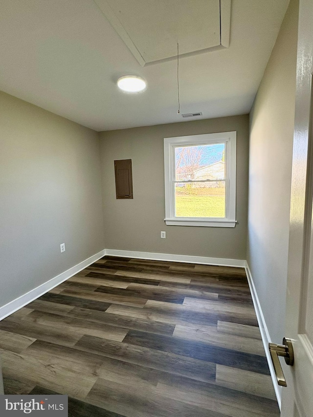 unfurnished room featuring dark wood-type flooring