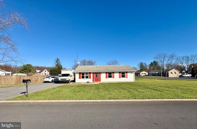 ranch-style home with a front yard