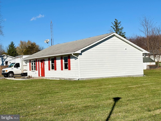 view of home's exterior featuring a lawn