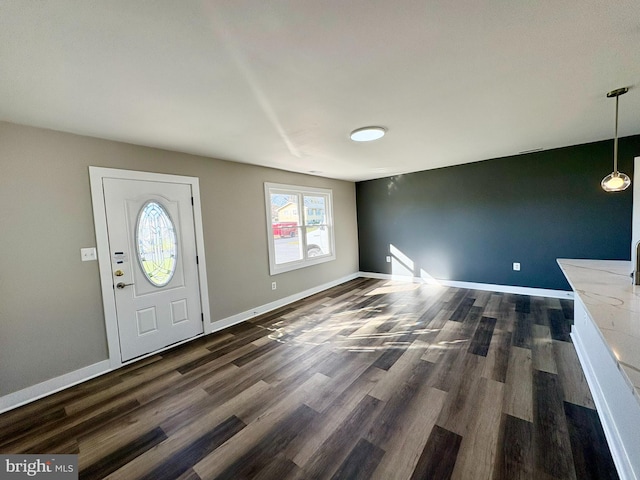 entryway with dark hardwood / wood-style flooring