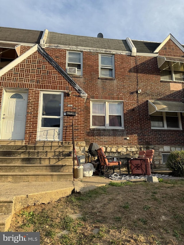 back of property featuring a patio area