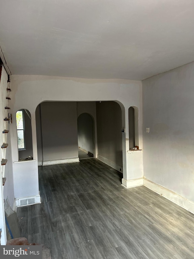 unfurnished room featuring dark hardwood / wood-style floors