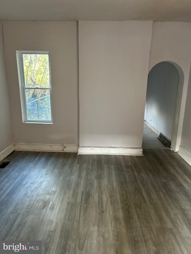 spare room featuring dark hardwood / wood-style flooring