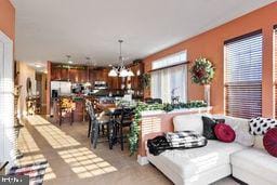 living room featuring an inviting chandelier