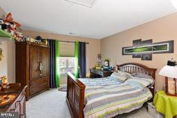 bedroom featuring light carpet