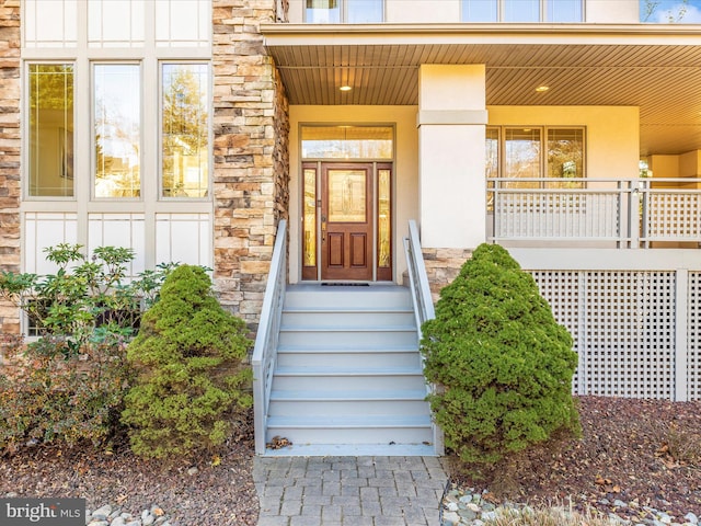 doorway to property with covered porch