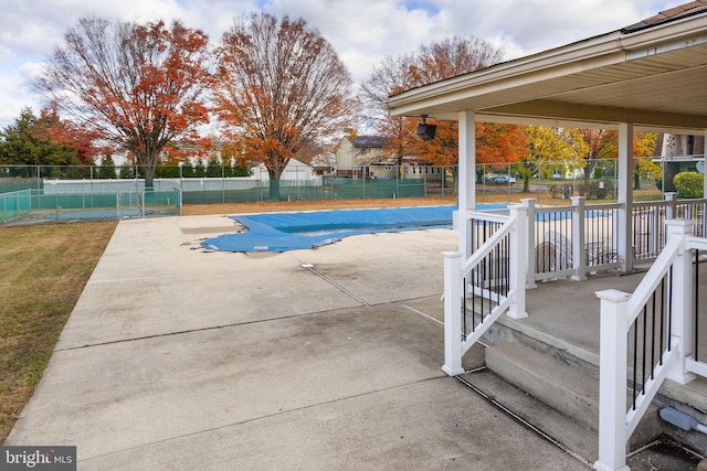 view of swimming pool featuring a patio