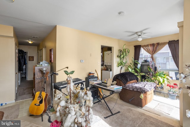 living room featuring ceiling fan and light carpet