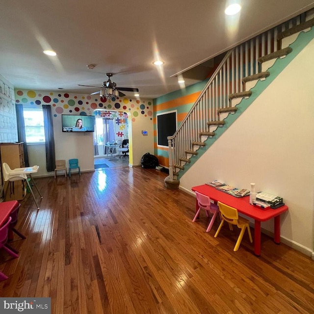 interior space with ceiling fan and wood-type flooring