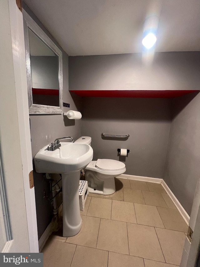 bathroom with tile patterned flooring and toilet