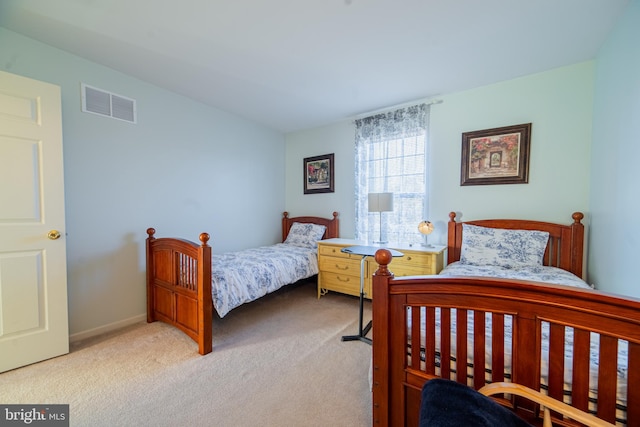 bedroom with light colored carpet