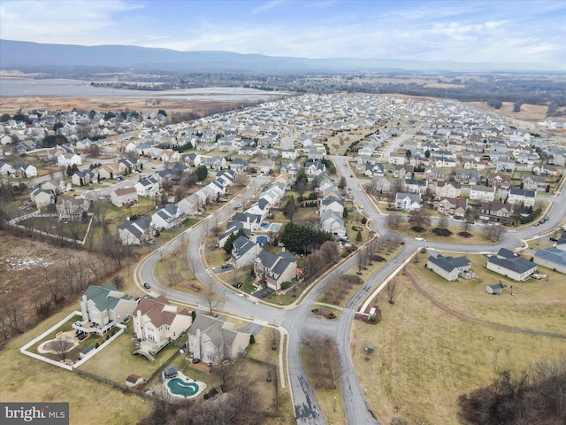 birds eye view of property featuring a mountain view