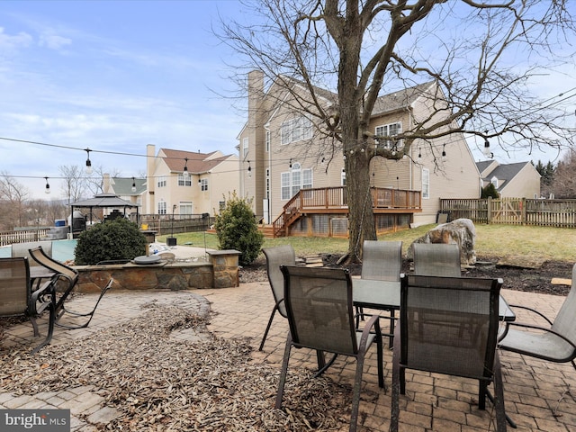 view of patio with a wooden deck and a gazebo