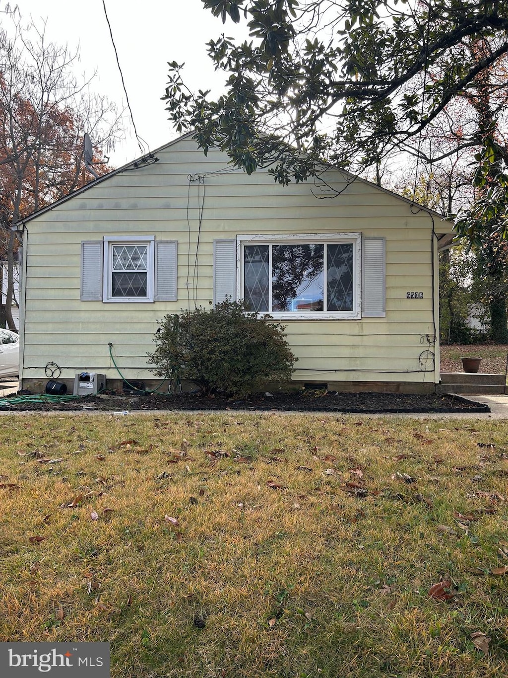 view of home's exterior featuring a lawn