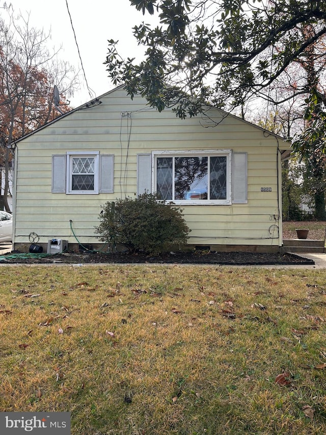 view of home's exterior featuring a lawn