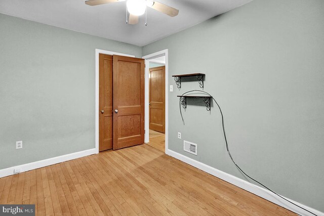 unfurnished bedroom featuring ceiling fan and light hardwood / wood-style flooring