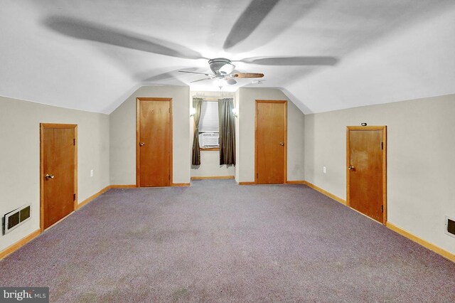 additional living space featuring ceiling fan, cooling unit, light colored carpet, and lofted ceiling