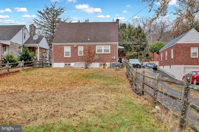 view of home's exterior with a yard