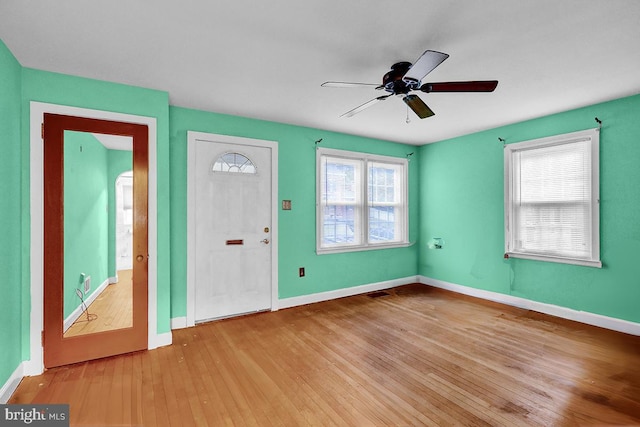 foyer entrance with light wood-type flooring and ceiling fan