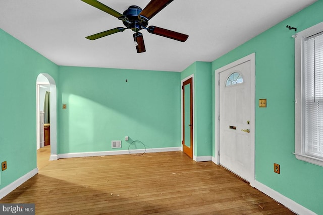 entryway with ceiling fan and light hardwood / wood-style flooring