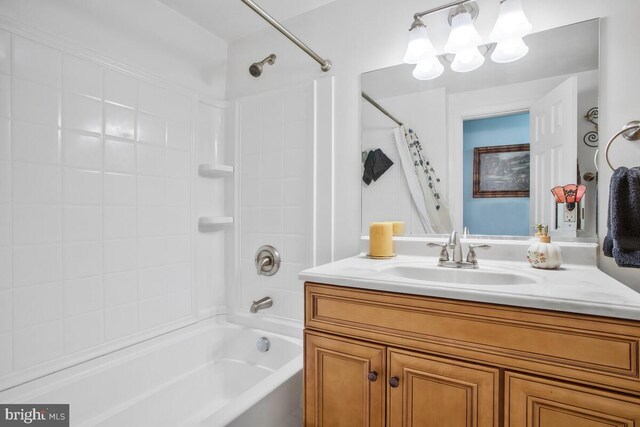 bathroom with shower / bath combination with curtain and vanity