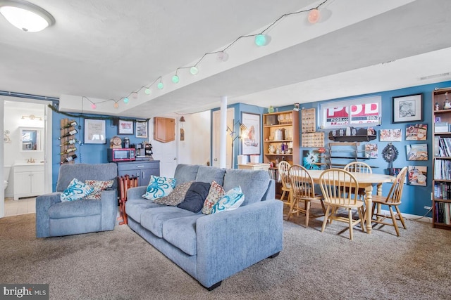 carpeted living room with sink and track lighting