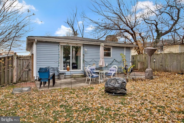 back of house featuring a patio area