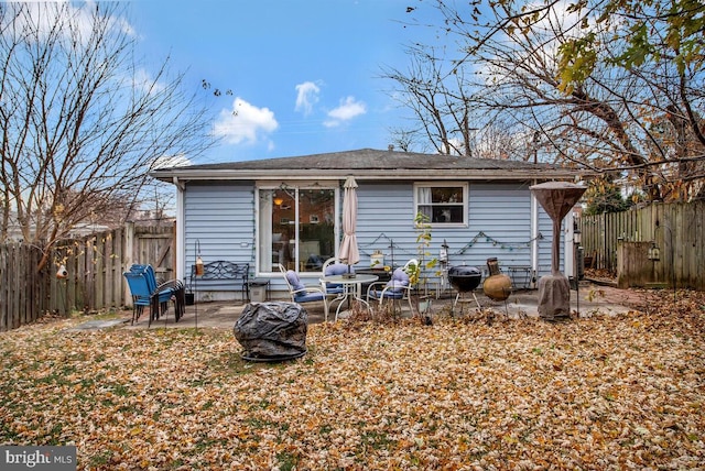 back of property with a patio area