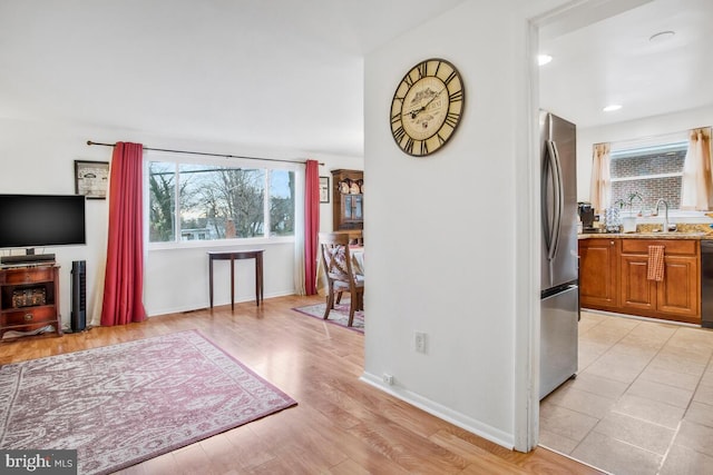 interior space with sink and light hardwood / wood-style flooring