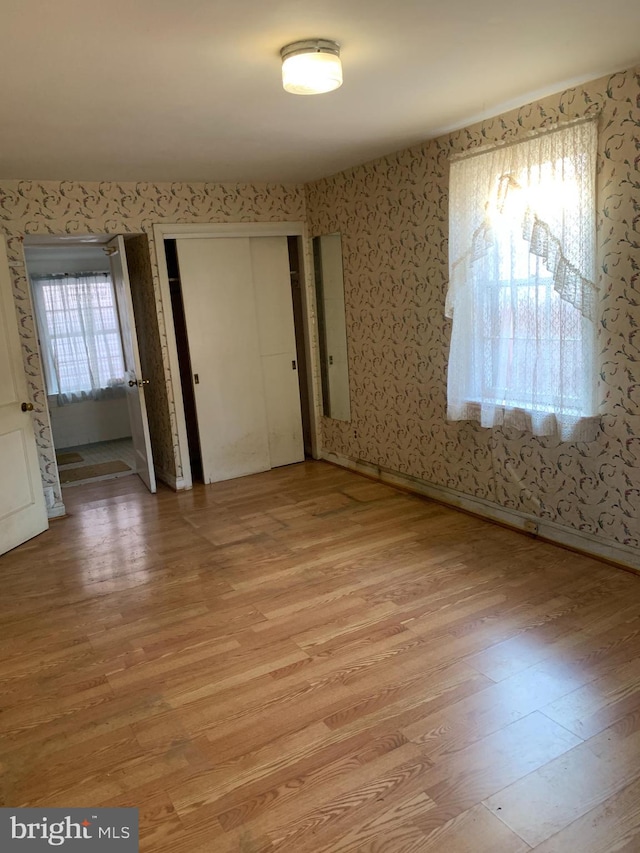 unfurnished bedroom with light hardwood / wood-style floors