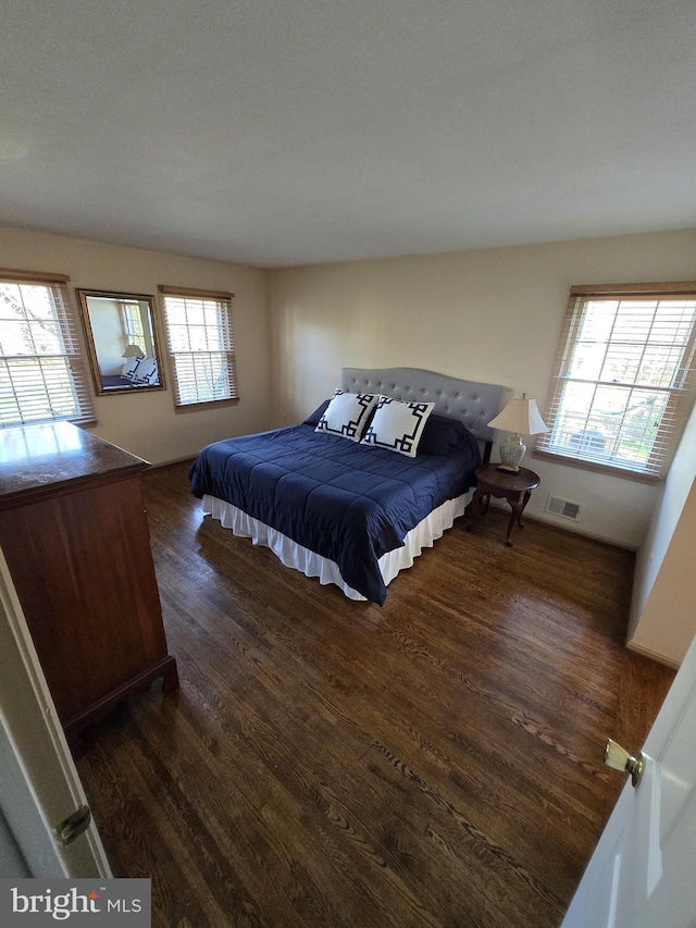 bedroom featuring dark hardwood / wood-style flooring