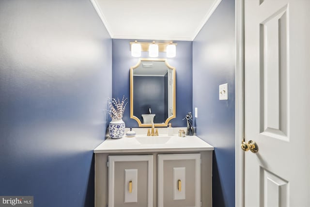 bathroom featuring crown molding and vanity