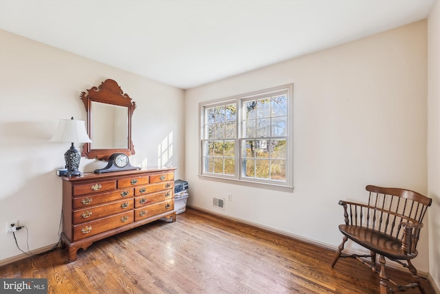 sitting room featuring hardwood / wood-style floors