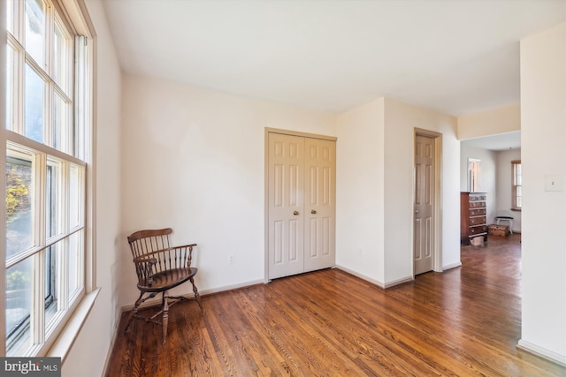 sitting room with dark hardwood / wood-style flooring