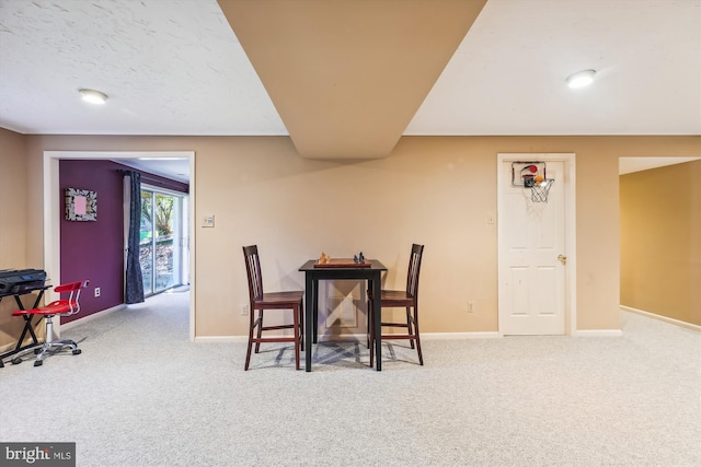 view of carpeted dining area