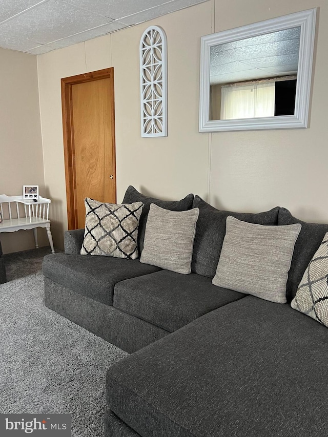 carpeted living room with a textured ceiling