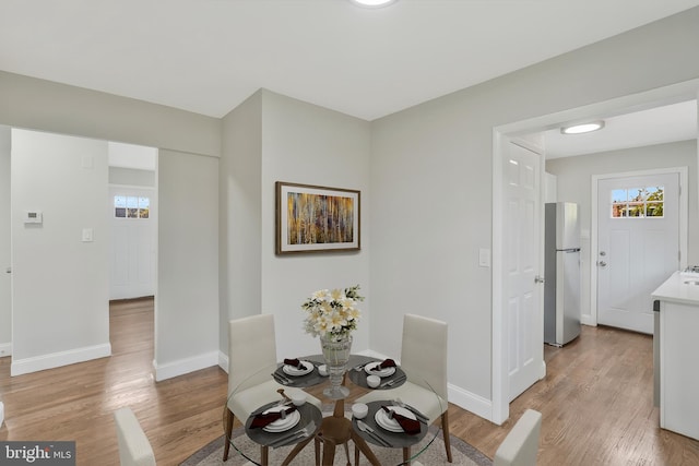 dining room featuring light wood-type flooring