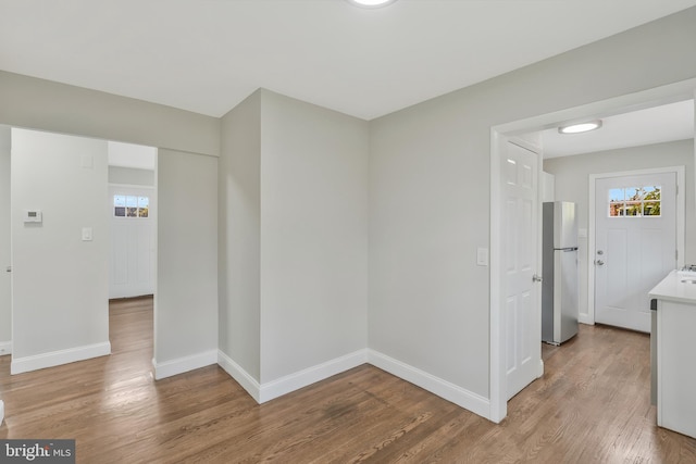 corridor featuring hardwood / wood-style flooring