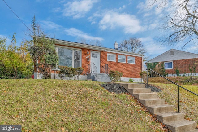 view of front of home with a front yard