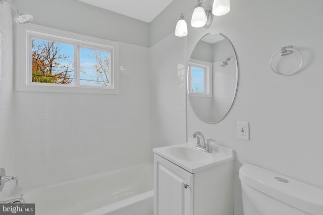 full bathroom featuring vanity, toilet, and tiled shower / bath