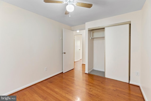 unfurnished bedroom with a closet, ceiling fan, and light hardwood / wood-style flooring