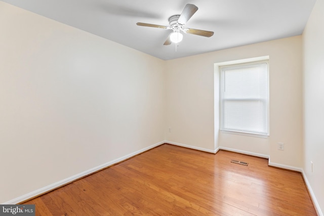 empty room featuring ceiling fan and light hardwood / wood-style flooring