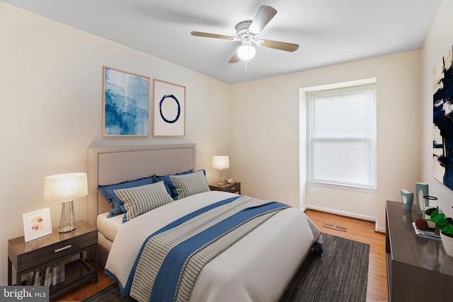 bedroom with wood-type flooring and ceiling fan