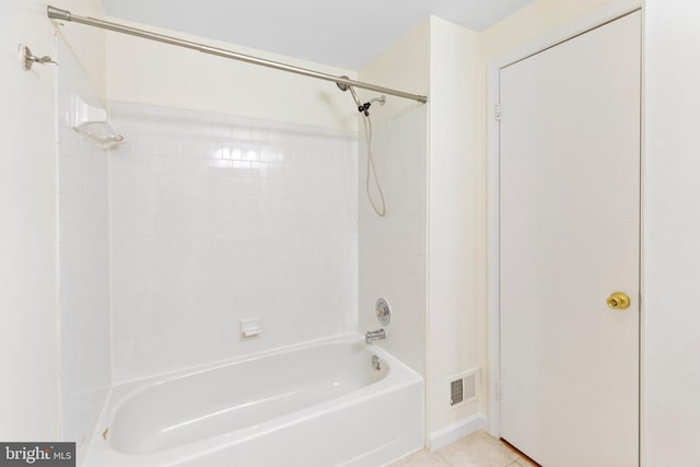 bathroom with tile patterned floors and tiled shower / bath