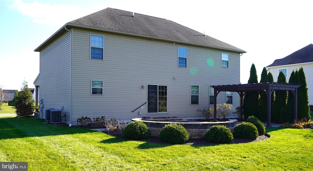 rear view of house featuring a pergola, a yard, and cooling unit