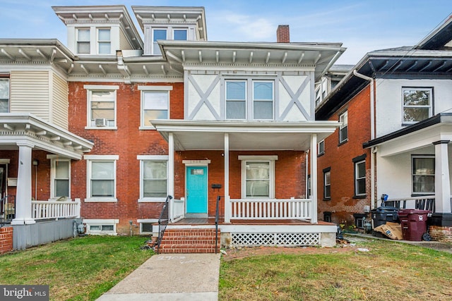 view of front of house with a front lawn and covered porch