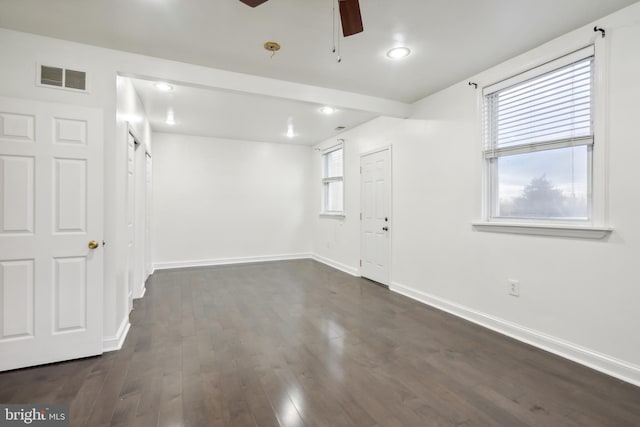 spare room featuring dark hardwood / wood-style floors