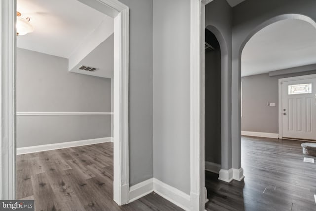 hall with hardwood / wood-style flooring