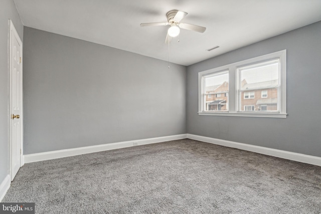 unfurnished room with ceiling fan and carpet floors